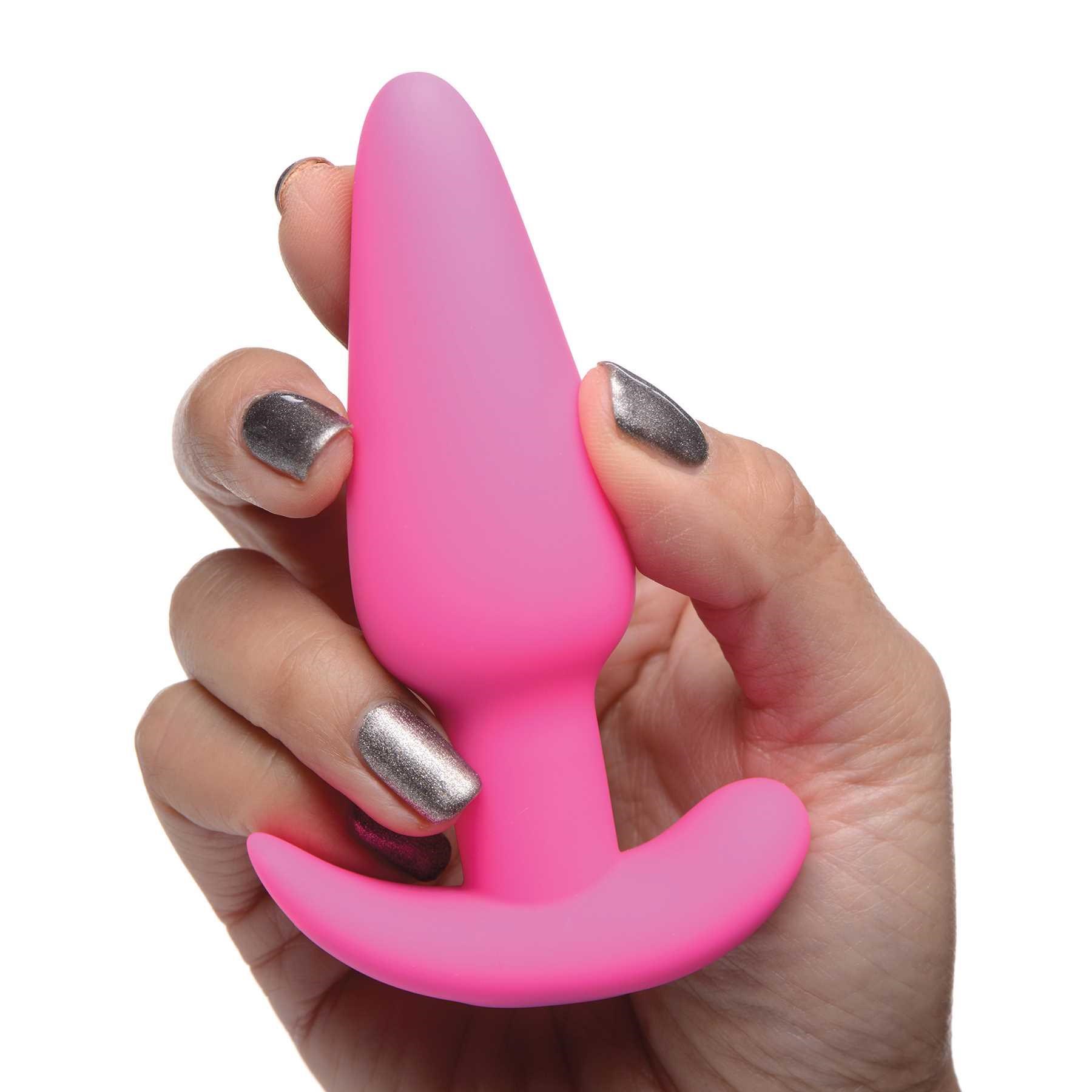 21X vibrating silicone butt plug hand shot