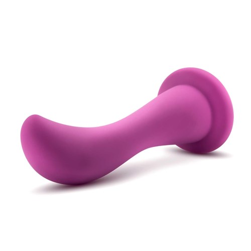 Temptasia Bellatrix Curved G-Spot Dildo 6.25 laying on table