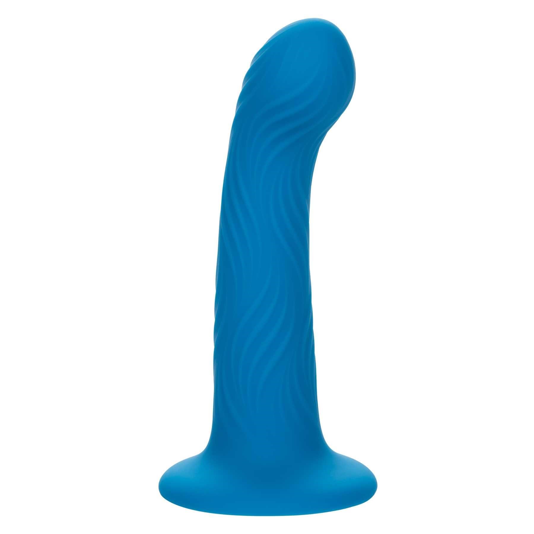 Wave Rider Ripple Liquid Silicone Dildo standing on table