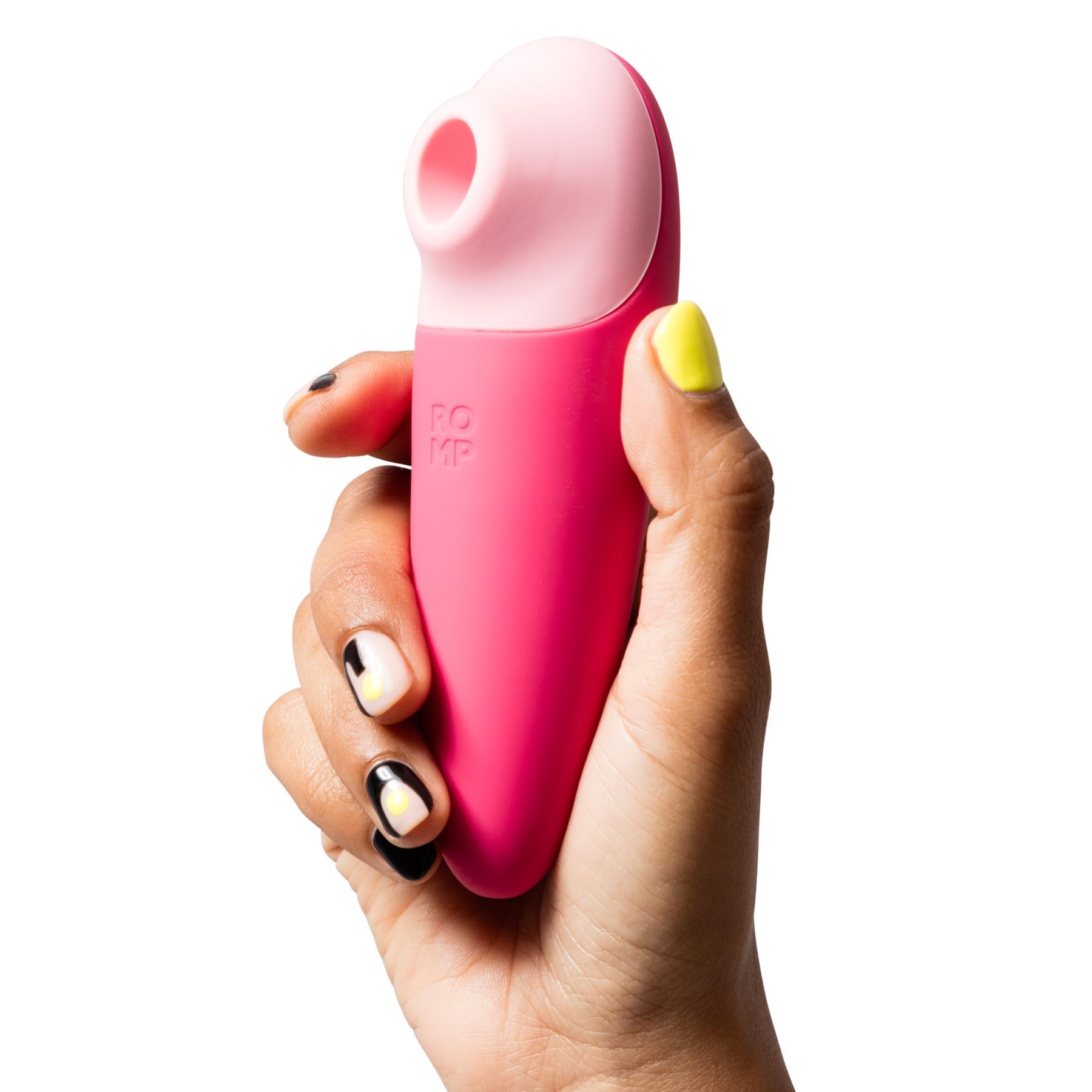 Romp Shine X Pleasure Air Clitoral Stimulator in hand shot