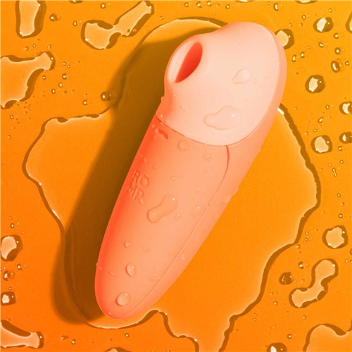 Romp Switch X Pleasure Air Clitoral Stimulator with background