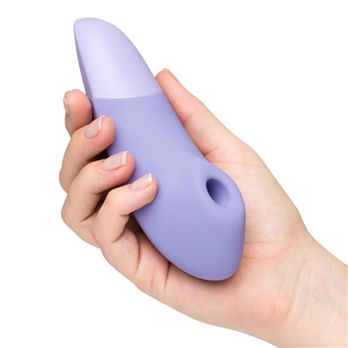 Womanizer Enhance Pleasure Air Clitoral Stimulator in hand